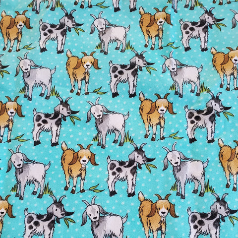 happy goats on aqua background fabric swatch