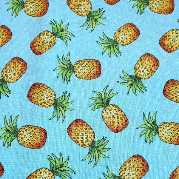 pineapples on aqua background fabric swatch